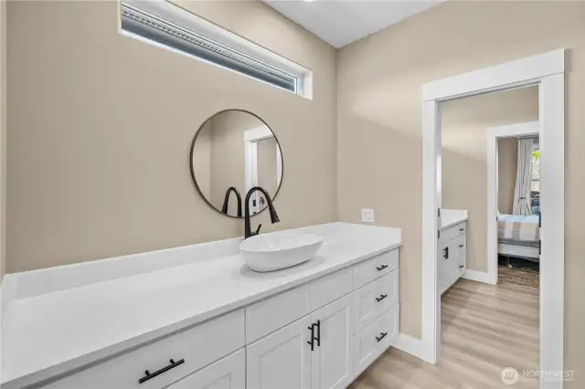 Ensuite bathroom 1 with quartz countertop.
