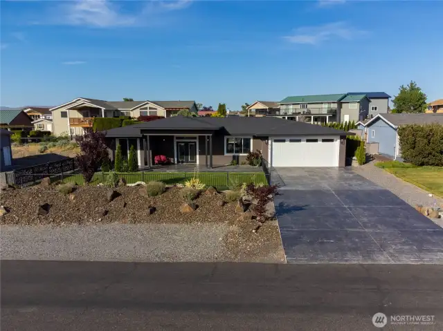 Front of home with professional landscaping.