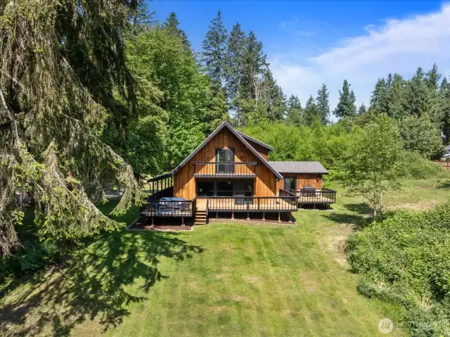 Aerial view of home and some of the acreage.