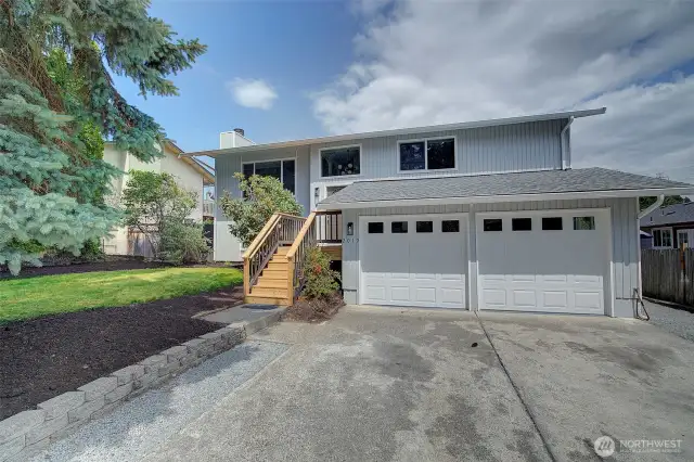 Better than new! New roof, windows, gutters, garage doors and more...