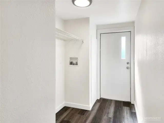 Laundry area with access to the back porch — function meets flow.
