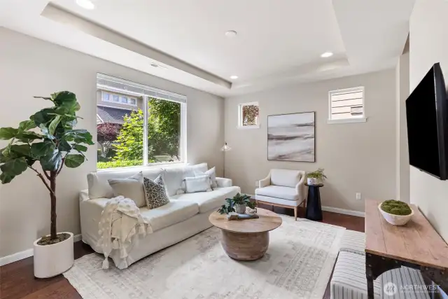 Formal living room, lots of windows to allow the light to shine through