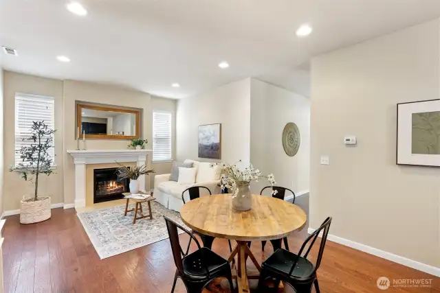 Spacious kitchen with dining area adjacent to cozy family room with fireplace