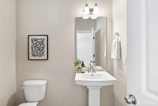 Main floor powder room off kitchen and family room