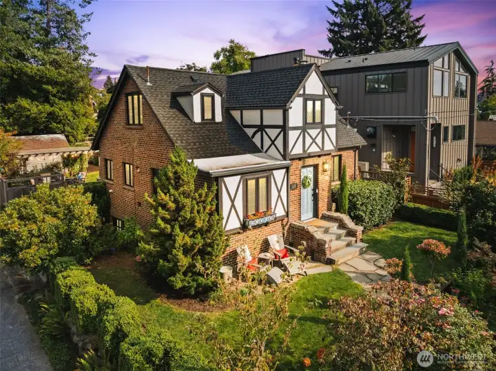 Stunning brick exterior, timber frame and gable new roof creates an elegant and classic Tudor look.