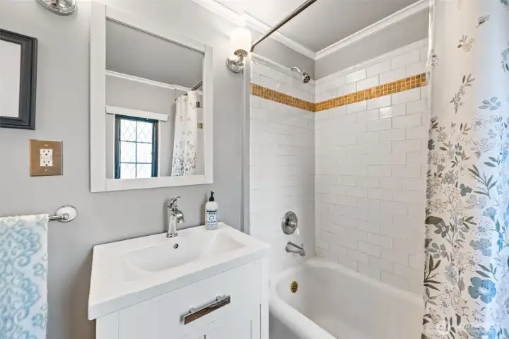 Full updated bath with Pottery Barn fixtures and classic subway tile.