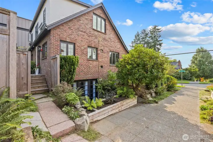 Gorgeous brick exterior and lush landscape are only a few highlights of this charming and elegant home.