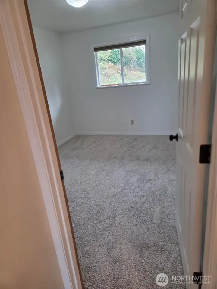 One bedroom with new carpet.