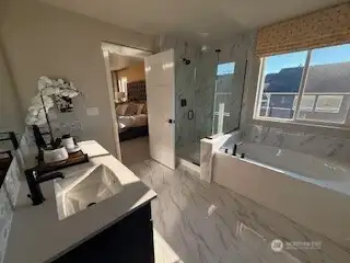 Gorgeous Suoer Primary 5 piece master bath with Upgraded tiles and features. Also featuring a large walk in closet!