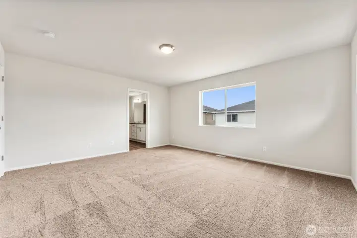 Primary Bedroom-Disclaimer- Photos are from a similar floor plan from another community, photos are for illustrative purposes only. Finishes, flooring, features, upgrades, countertops, paint, colors, and other features may vary.