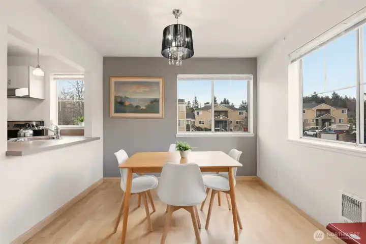 Spacious dining room with breakfast bar pass through into the kitchen.