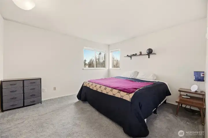 2nd floor primary bedroom has enough room for a king size bed plus plenty of furniture.