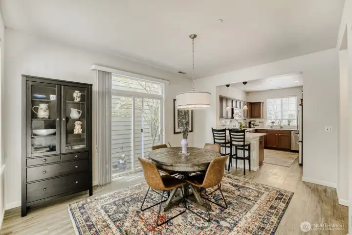 The dining room flows into the large kitchen with all new LVP flooring and abundant light.