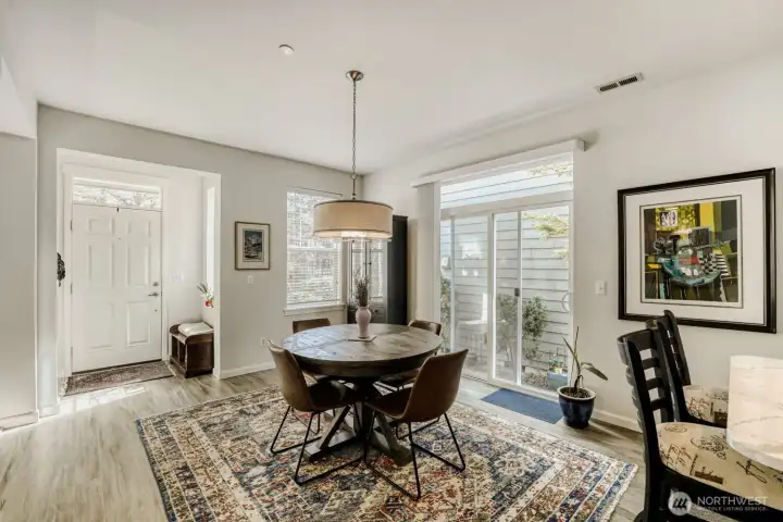 The front entry is welcoming to guests and the sliding door leads to a charming side yard that is fully fenced with a gate in the back to the garage.