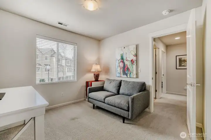 This room is perfect for an in-home office, but easily becomes a 3rd bedroom for guests.