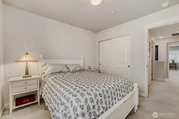Another view of the guest bedroom with a large closet.