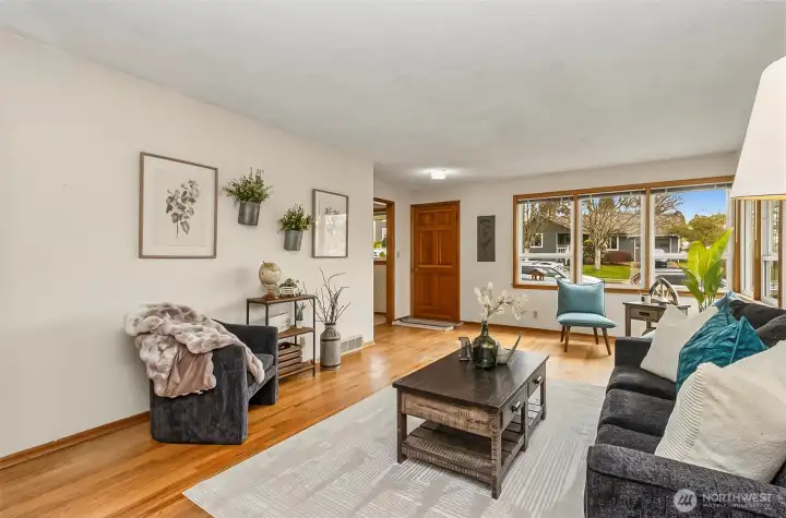 Looking out at the front door and those wonderful double pane windows with 100% natural light filling up the living room
