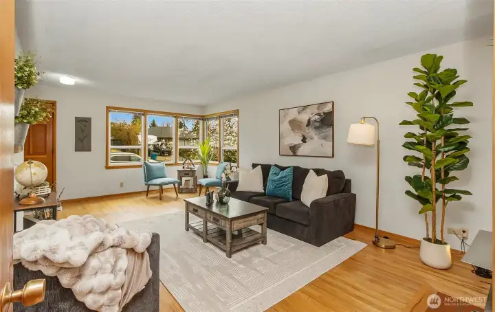 Shows the large windows, original hardwood flooring