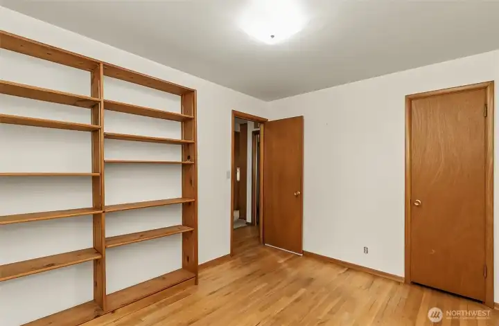 Built in shelving for extra storage, 1st bedroom looking out to the hallway