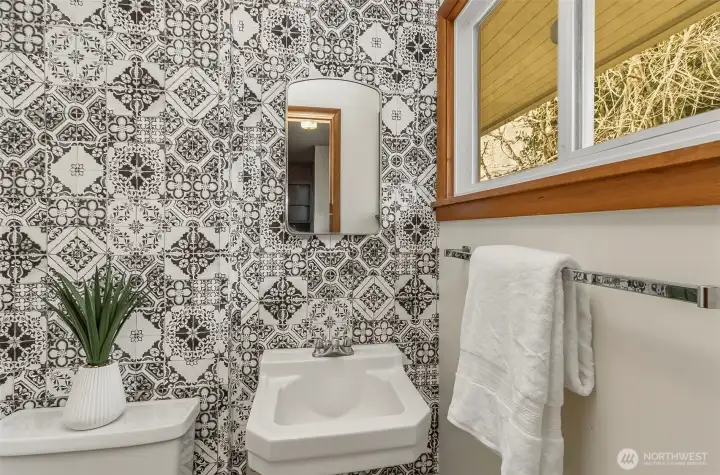 Guest half bath is cute and great natural lighting in here too!