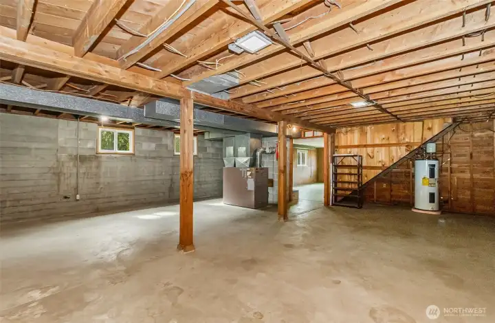 The basement continues with a new furnace and hot water tank, the space is clean and has excellent potential