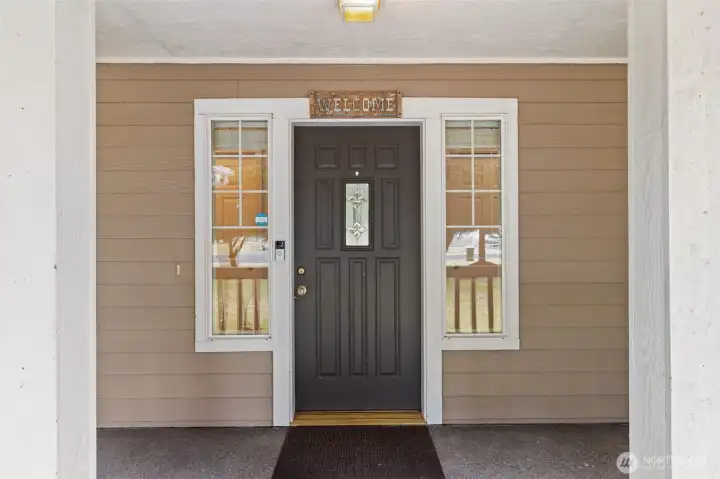 Covered front porch offering welcoming curb appeal and the perfect place for rocking chairs and quiet evenings. Welcome home!