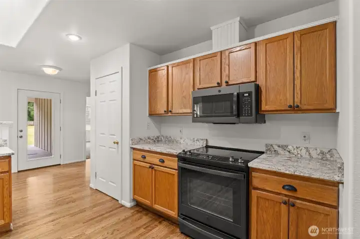 Kitchen features nearly new appliances, pantry storage, and generous counter space designed for both everyday living and entertaining