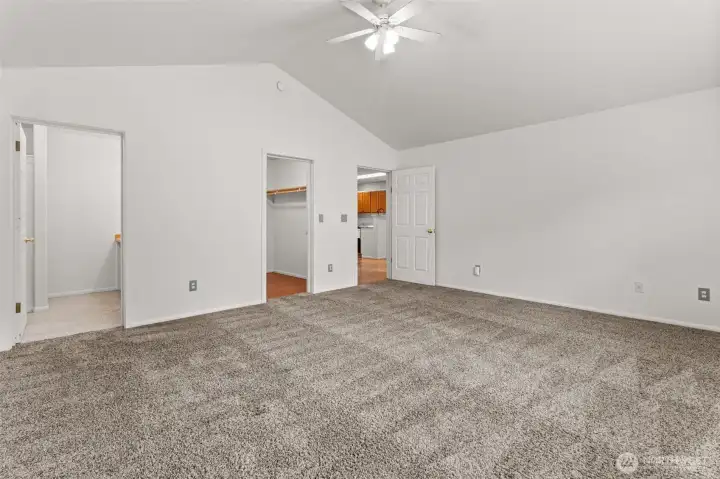 Spacious primary suite with plenty of natural light, walk-in closet, and attached bath designed for comfort and privacy with a split bedroom floor plan.