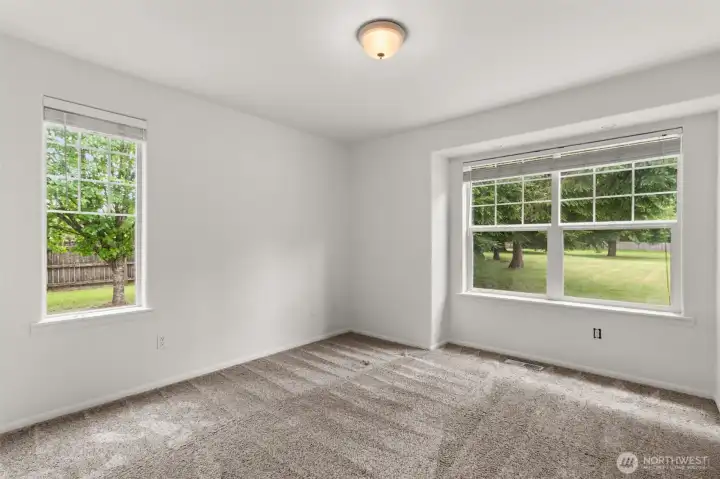 Bedroom 3 with relaxing views over the backyard and flexible space for guests, office, or additional living needs