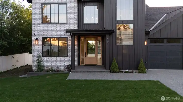 Oversized 42" entry door with sidelites. Harbor views straight through to the backyard.