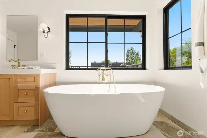 Freestanding tub with Kingston Brass tub filler