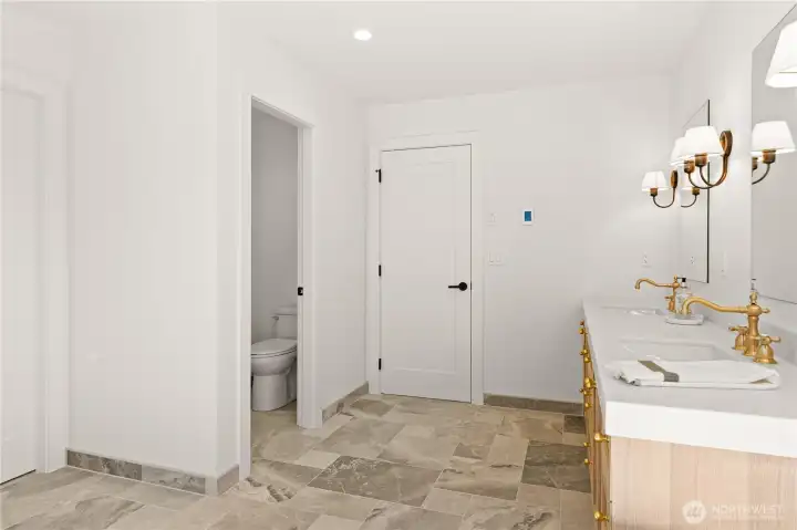 Separate water closet for added privacy in primary bath.