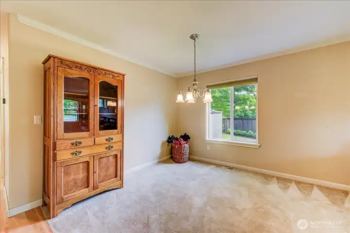 Dining area with view of right side yard.