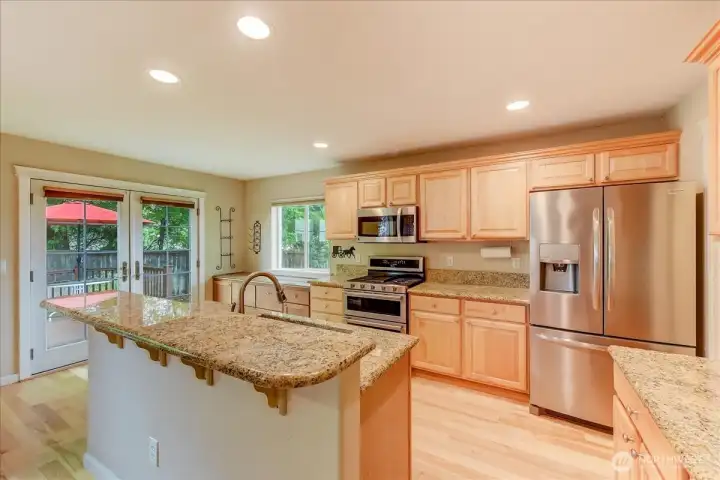 Nice views from main kitchen with breakfast bar. Fridge new in 2020 and oven in 2022