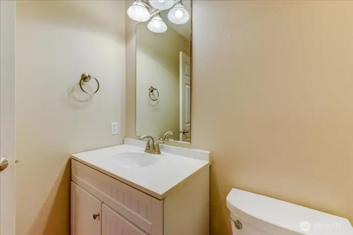 Powder room in main hall with soft closing toilet