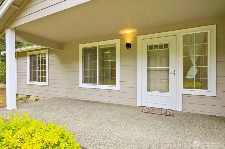 The large covered front porch keeps guest dry at the front door.