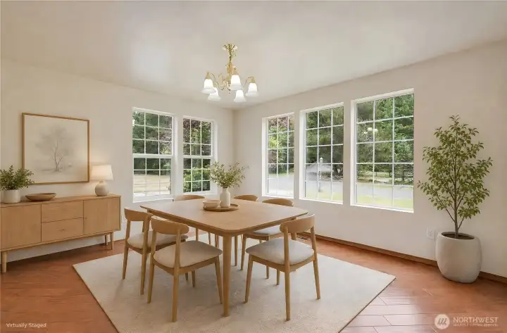 Entering the home there is bright and cheery formal dining room, that could also be a nice family room. T,his room is virtually staged