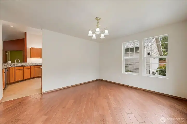 This picture shows the dining room in proximity to the kitchen.