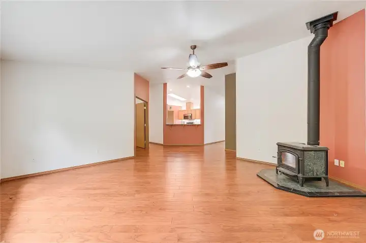 Looking back to the kitchen, and the French doors go to a large den or office space.