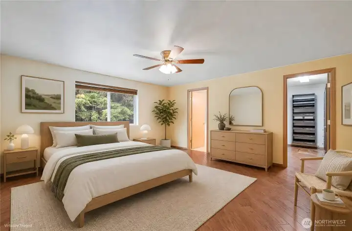 The spacious primary suite is a first-class retreat. It is virtually staged.