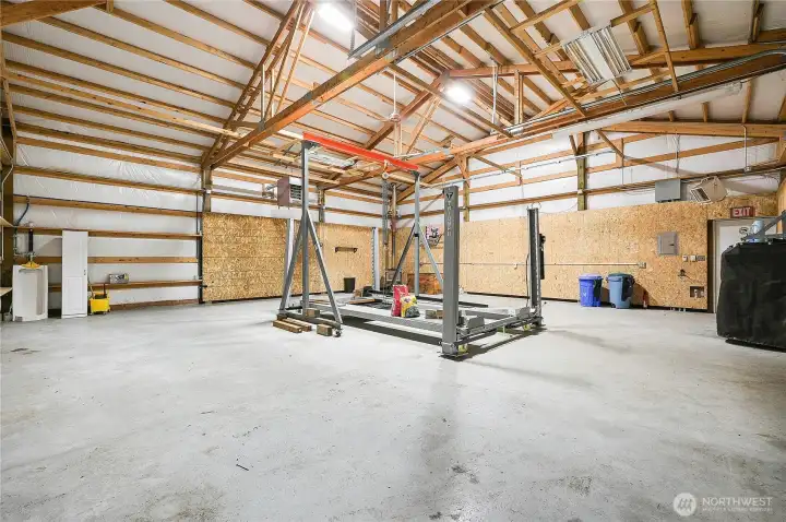The shop has propane unit heaters and urinal on the left, it has it all.