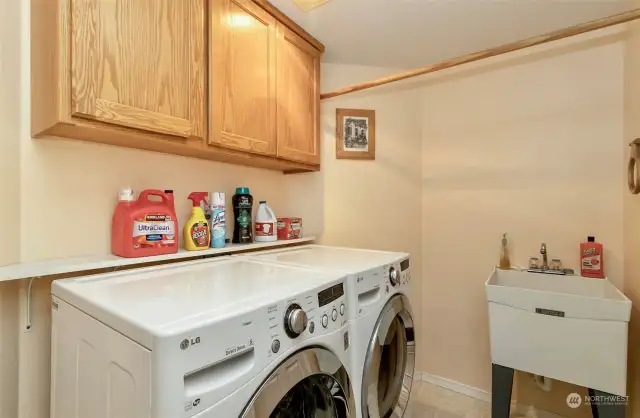 Laundry room has sink and the washer and dryer stay with the home.