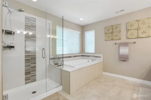 Large soaking tub and brand new shower glass in primary bathroom