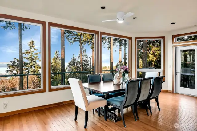 The door off the dining room opens to a wrap-around deck, perfect for outdoor entertaining.