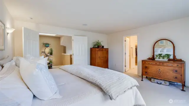 Grand double door entry in the Primary bedroom with a peak into the Primary bath.