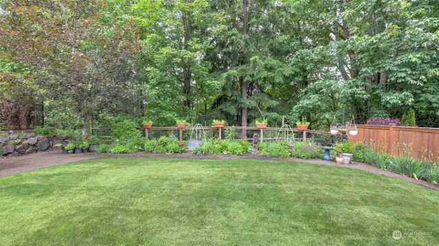 Lush landscaping with perennials returning year after year add to the privacy. All serviced by an added sprinkler system.