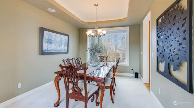 Dining room offers in-wall speakers perfect for entertaining family and includes views to the private backyard.