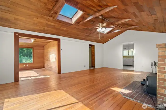 Skylights, exposed beams and original fir floors.