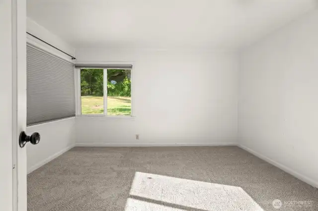 Primary bedroom with brand new carpet.