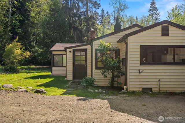 Enter through the front door into an enclosed porch, or use the back door for direct access to the utility/laundry room